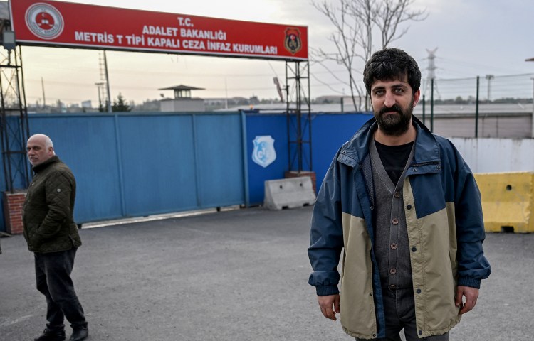 AFP photographer Yasin Akgul stands outside the Metris Prison after his release in Istanbul on March 27.