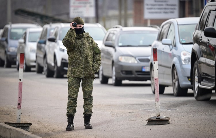 A soldier from the Transnistria breakaway reagion of Moldova records the presence of the media at the Varnita crossing point with Moldova, on March 1, 2024. (Photo: AFP/Daniel Mihailescu)